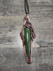 Artisan made copper pendant with a natural jade stone.